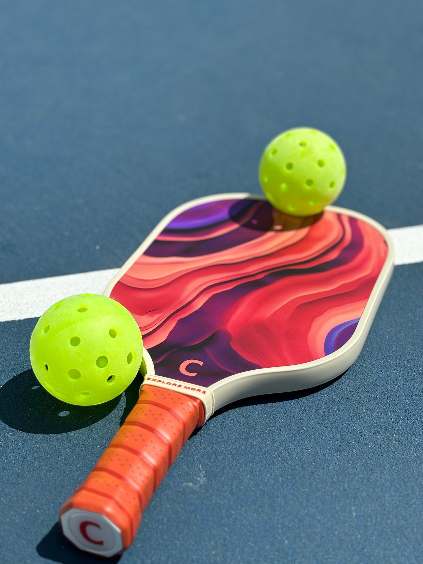 The Aurora Pickleball Paddle With 2 Pickleballs