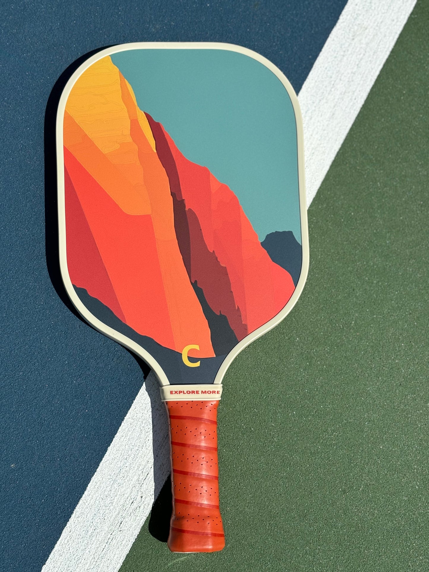 The Grand Pickleball Paddle Front On A Court 