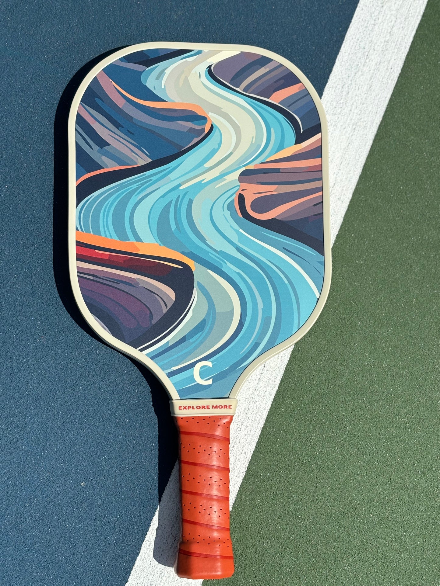 The River's Edge Pickleball Paddle Front On A Court 